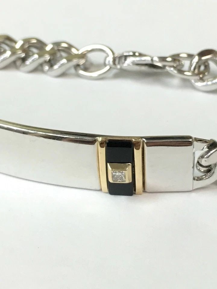 STERLING SILVER ID BRACELET, 0.10CT DIAMOND, ONYX, 14K GOLD TRIM ( 8.5 INCH ): STERLING SILVER ID BRACELET WITH A DIAMOND, BLACK ONYX AND 14K YELLOW GOLD 8.5IN Sterling Silver ID Bracelet with a Diamond, Black Onyx and 14K Yellow Gold Accent You are bidding on a pre-owned Sterli