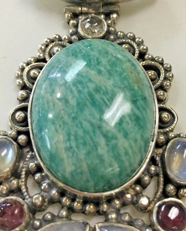 RARE VINTAGE STERLING SILVER PENDANT WITH AMAZONITE 58.3G: RARE VINTAGE STERLING SILVER PENDANT WITH AMAZONITE STONE Rare Vintage Sterling Silver Pendant with Amazonite Stone You are bidding on a pre-owned Rare Vintage Sterling Silver Pendant with Amazonite S