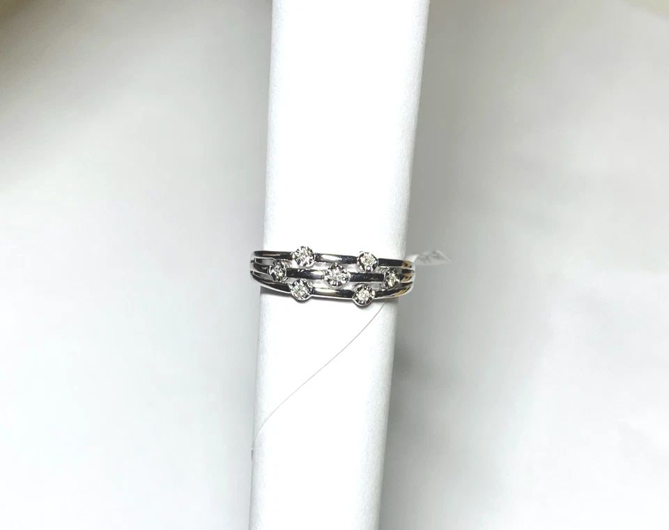 NEW 10K WHITE GOLD RING WITH 0.07CTW DIAMONDS (SIZE 6.75) 2.2 GRAM: WOMEN'S 10K WHITE GOLD RING WITH 0.07CT DIAMONDS (SIZE 6.75) Women's 10k White Gold Ring with 0.07CT Diamonds (Size 6.75) You are bidding on a new with tags Women's 10k White Gold Ring with 0.07CT Dia