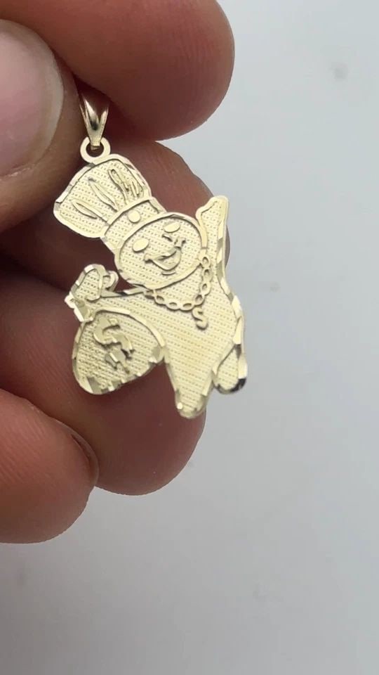 NEW 10K GOLD DOUGH BOY WITH MONEY BAG PENDANT 2.0 GRAMS: 10k Gold Dough Boy with Money Bag Pendant 2.0 grams Condition: Brand New, Display Model. Refer to condition description above and pictures. Material: 10k Yellow Gold Pendant Size: 20mm wide, 25mm tall
