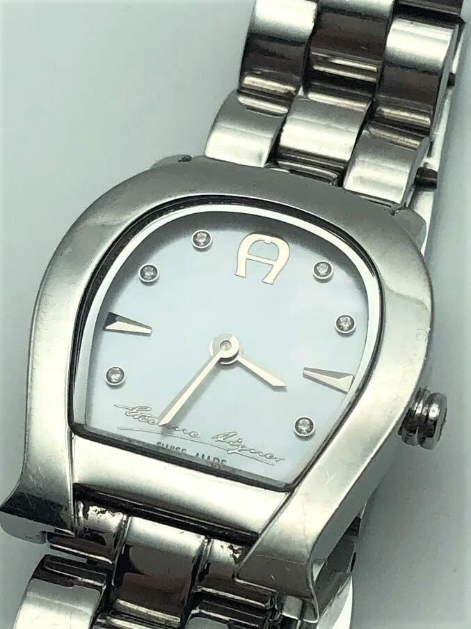 AIGNER VARESE MOTHER OF PEARL WOMENS WATCH: AIGNER VARESE MOTHER OF PEARL WOMENS WATCH WOMENS AIGNER VARESE WATCH You are bidding on a used women's Aigner watch. The watch has been fully checked and inspected by our in house Jewelers. The watch