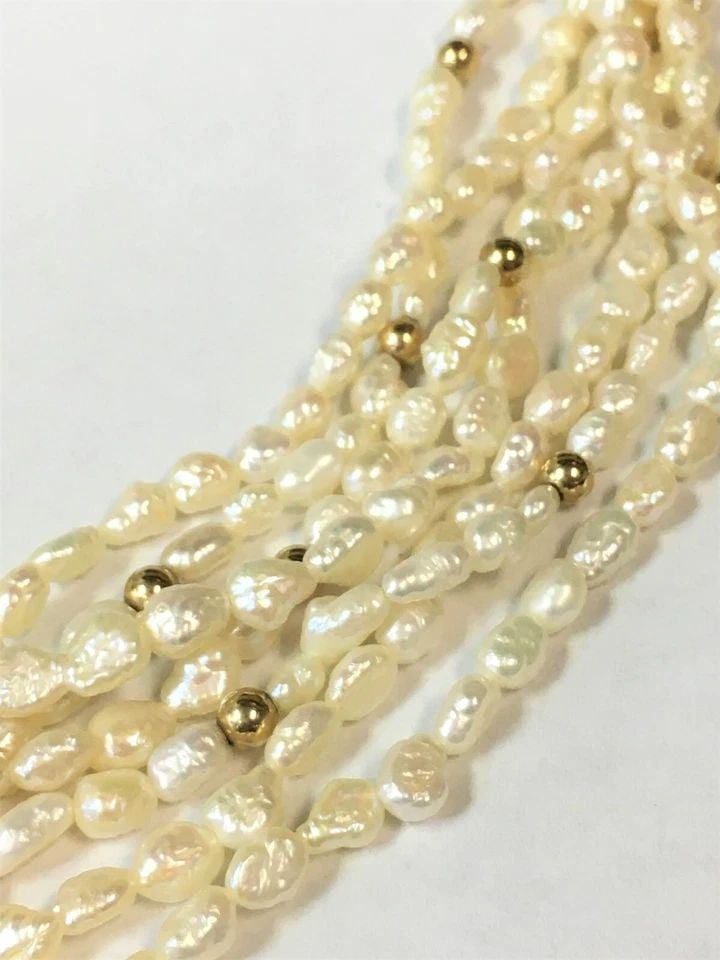FRESH WATER 7 STRAND PEARL NECKLACE, 14K GOLD CLASP & BEADS ( 20" ) 75.5G: FRESH WATER 7 STRAND PEARL NECKLACE WITH 14K YELLOW GOLD CLASP AND BEADS (20") Fresh Water 7 Strand Pearl Necklace with 14k Yellow Gold Clasp and Beads You are bidding on a Fresh Water 7 Strand Pearl 