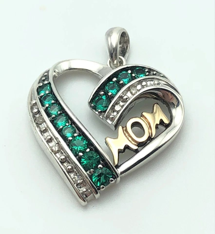 SILVER HEART PENDANT, 14K GOLD MOM, 0.05CTS DIAMONDS, LAB-CREATED EMERALDS 4.3G: SILVER HEART PENDANT WITH 14K GOLD MOM, DIAMONDS AND SYNTHETIC EMERALDS Silver Heart Pendant with 14k Gold Mom, Diamonds and Synthetic Emeralds You are bidding on a Silver Heart Pendant with 14k Gold 