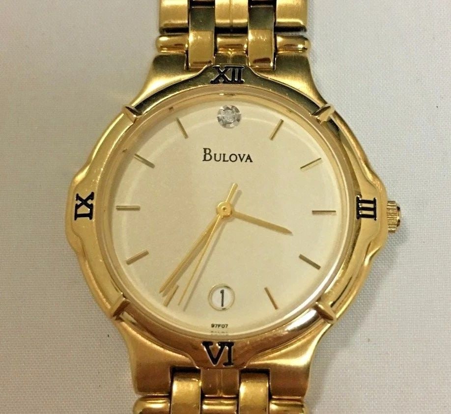 BULOVA SINGLE STONE 17 BASE METAL BEZEL YELLOW GOLD TONE 97F07 (1 of 2)
