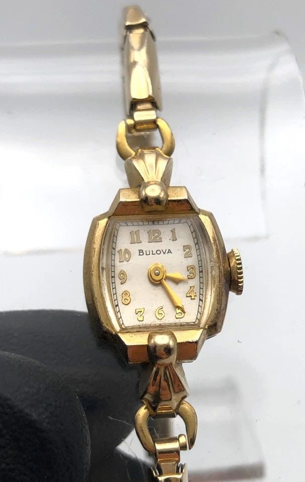 VINTAGE BULOVA WOMAN'S WATCH 10K ROLLED GOLD PLATED CASE 21 JEWELS MOVEMENT: 14K GOLD CASE VINTAGE BULOVA WOMAN'S WATCH 21 JEWELS MOVEMENT 14k Gold Case Vintage Bulova Woman's Watch 21 Jewels Movement Condition: Used vintage, running and keeps time Material: Solid 14k Yellow G