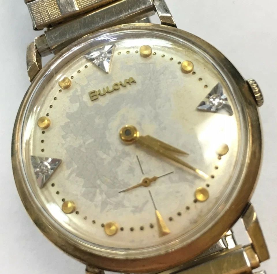 VINTAGE BULOVA 10K GOLD FILLED, STRETCH BAND WATCH (1 of 2)