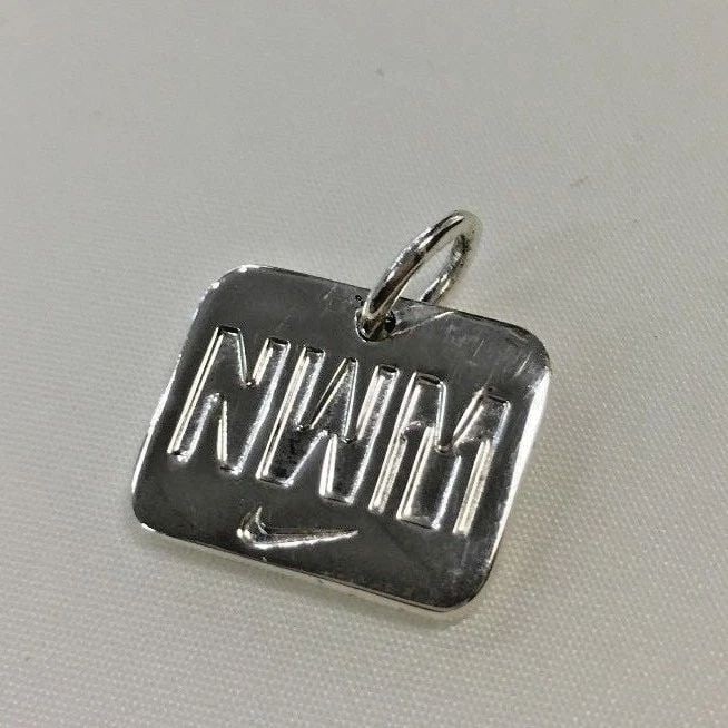 TIFFANY & CO. STERLING SILVER 2011 NIKE WOMEN'S MARATHON PENDANT (1 of 2)