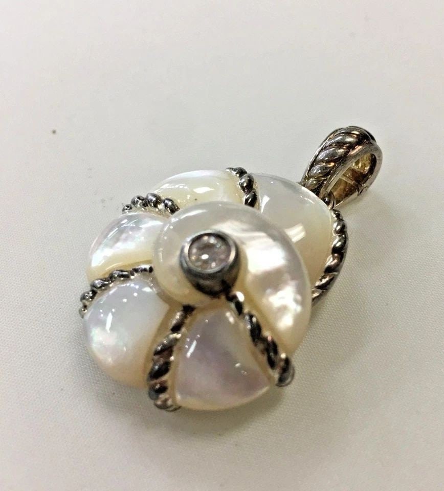 JUDITH RIPKA STERLING MOTHER OF PEARL DQCZ PENDANT: JUDITH RIPKA STERLING MOTHER OF PEARL DQCZ PENDANT Judith Ripka Sterling Mother of Pearl DQCZ Pendant You are bidding on a pre-owned Judith Ripka Sterling Mother of Pearl DQCZ Pendant. There are few m