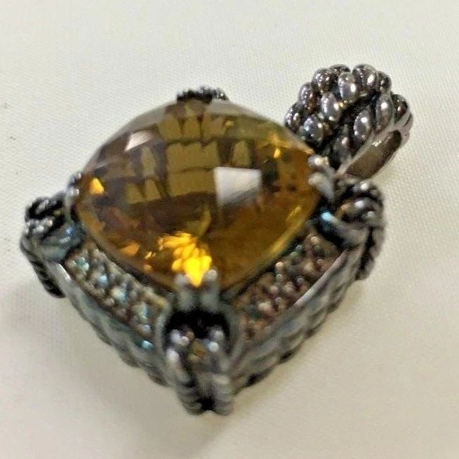 SJM STERLING SILVER CITRINE PENDANT: SJM STERLING SILVER CITRINE PENDANT SJM Sterling Citrine Pendant You are bidding on a pre-owned SJM Sterling Citrine Pendant. There are few minor scratches on the pendant from normal wear and tear, it