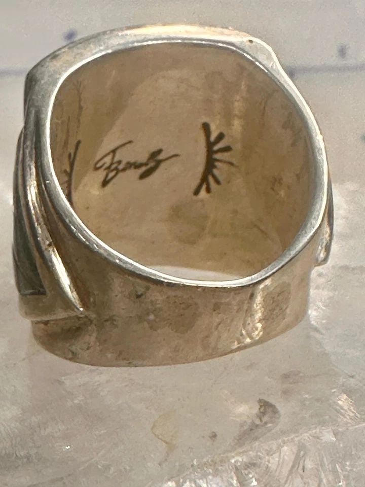 FERNANDO BENALLY RING SIZE 8.25 NAVAJO STERLING SILVER WOMEN MEN: FERNANDO BENALLY RING SIZE 8.25 NAVAJO STERLING SILVER WOMEN MEN Fernando Benally ring size 8.25 Navajo sterling silver women men From the "Medicine Mask" collection. The corn plant on the ring repres