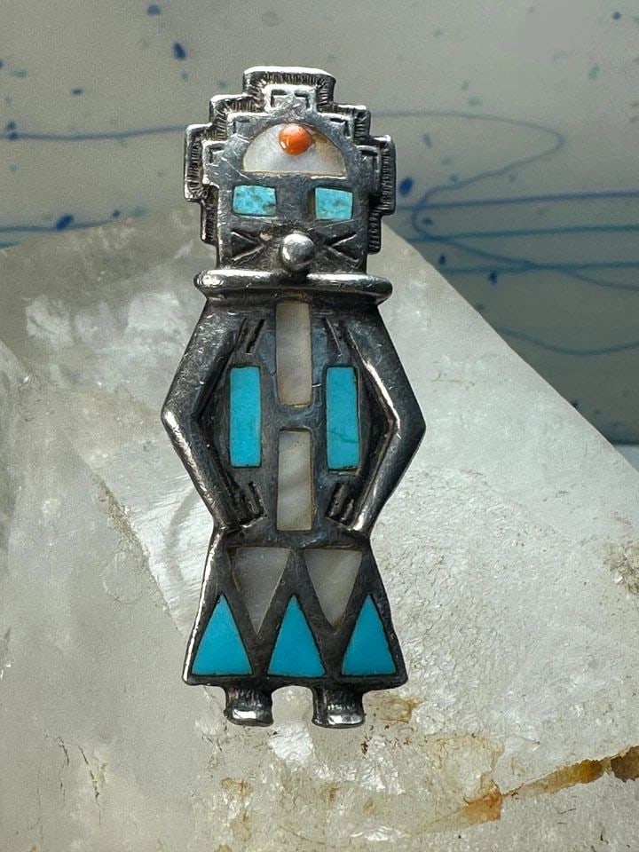 LARGE KACHINA RING NAVAJO TURQUOISE MOTHER OF PEARL CORAL SIZE 7 STERLING SILVER: LARGE KACHINA RING NAVAJO TURQUOISE MOTHER OF PEARL CORAL SIZE 7 STERLING SILVER Kachina ring Navajo turquoise mother of pearl coral size 7 sterling silver women Size 7 Weight. 24g Length. 2. 1/4" Wid