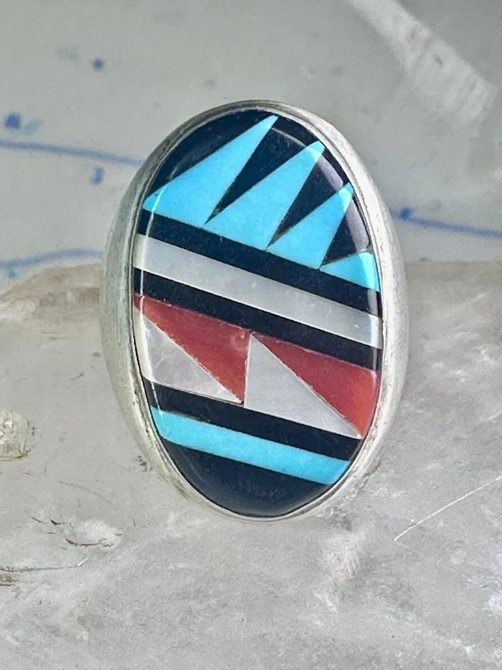 ZUNI RING TURQUOISE CORAL MOP ONYX BAND SIZE 8.25 STERLING SILVER WOMEN MEN: ZUNI RING TURQUOISE CORAL MOP ONYX BAND SIZE 8.25 STERLING SILVER WOMEN MEN Zuni ring Turquoise coral MOP Onyx band size 8.25 sterling silver women men Size 8.25 Weight 17.7g Length 1" Width 5/8" Thin