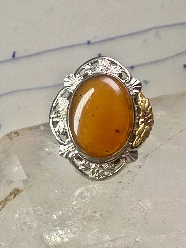 BLACK HILLS GOLD RING LONG STONE LEAVES SIZE 7.50 STERLING SILVER WOMEN GIRLS: BLACK HILLS GOLD RING LONG STONE LEAVES SIZE 7.50 STERLING SILVER WOMEN GIRLS Black Hills Gold ring large stone leaves size 7.50 sterling silver women girls Size. 7.50 Between. size 7.50 and a size 7.