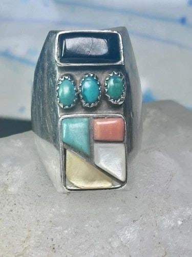 NAVAJO RING TURQUOISE CORAL ONYX MOP BAND SIZE 11 STERLING SILVER MEN: NAVAJO RING TURQUOISE CORAL ONYX MOP BAND SIZE 11 STERLING SILVER MEN Navajo Ring turquoise coral onyx mop band size 11 sterling silver men Flaws: Bottom yellowish Mother of pearl has a stone that has