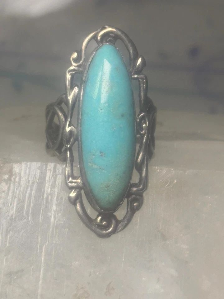 LONG TURQUOISE RING ART DECO PEACE SIZE 6.5 STERLING SILVER WOMEN GIRLS: LONG TURQUOISE RING ART DECO PEACE SIZE 6.5 STERLING SILVER WOMEN GIRLS Long Turquoise ring Art Deco Peace size 6.5 sterling silver women girls Size 6.5 Weight. 6.9g Length 1 1/2" Width 9/16" Thinnest