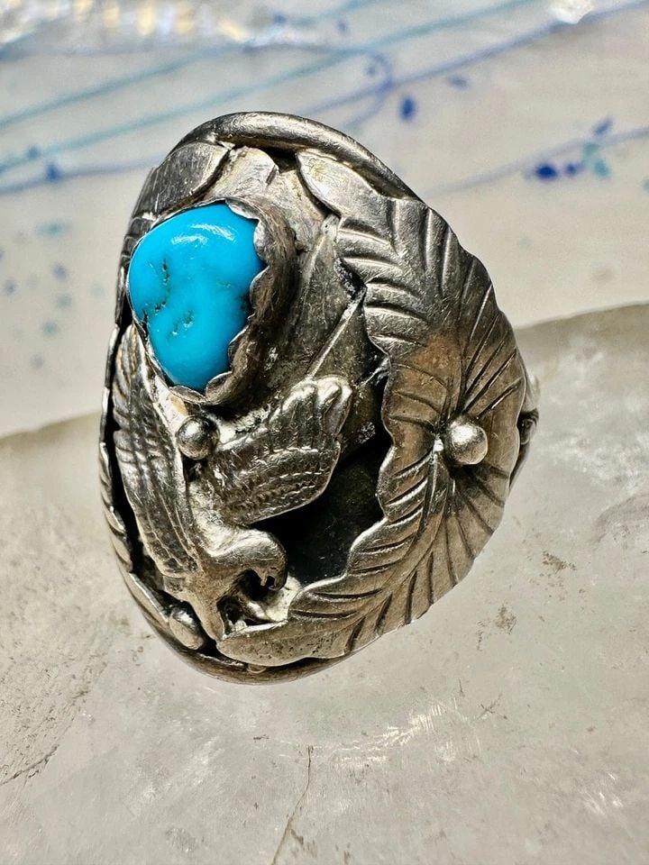 NAVAJO RING SIZE 14.25 EAGLE TURQUOISE NATIVE AMERICAN STERLING SILVER: NAVAJO RING SIZE 14.25 EAGLE TURQUOISE NATIVE AMERICAN STERLING SILVER May have been resized strcturally sound Size 14.25 Between a size 14.25 and a size 14.50 Weight 13.3g Length. 1 1/4" Thinnest par