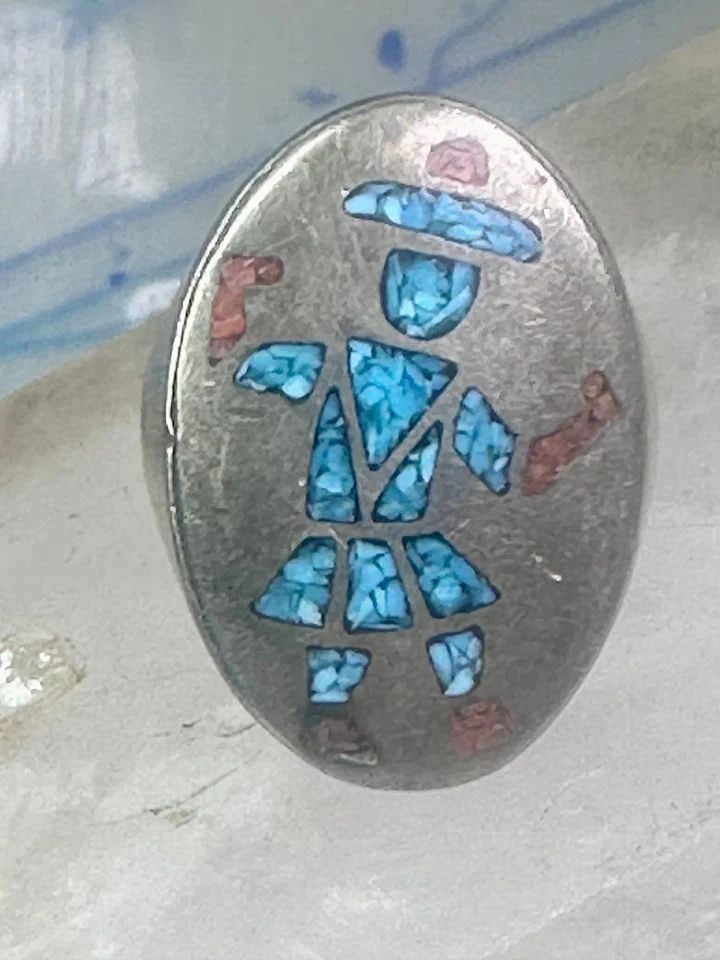 KACHINA RING TURQUOISE CHIPS RING CORAL BAND SIZE 11 STERLING SILVER WOMEN MEN: KACHINA RING TURQUOISE CHIPS RING CORAL BAND SIZE 11 STERLING SILVER WOMEN MEN Kachina ring Turquoise chips ring coral band size 11 sterling silver women men Size 11 Weight 25.3g Length. 1 1/4" Width.