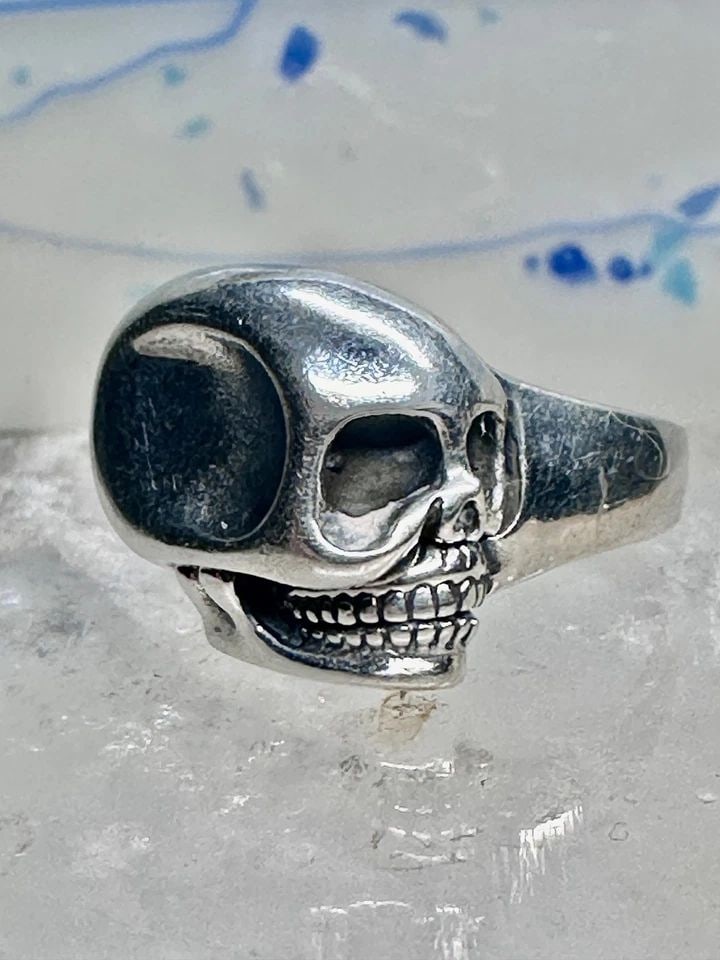 SKULL RING POISON BIKER BAND SIZE 9.25 STERLING SILVER WOMEN MEN: SKULL RING POISON BIKER BAND SIZE 9.25 STERLING SILVER WOMEN MEN Skull ring poison biker band size 9.25 sterling silver women men Size 9.25 Weight 9.5g Length. 5/8" Width 5/8" Thinnest part of band 5/