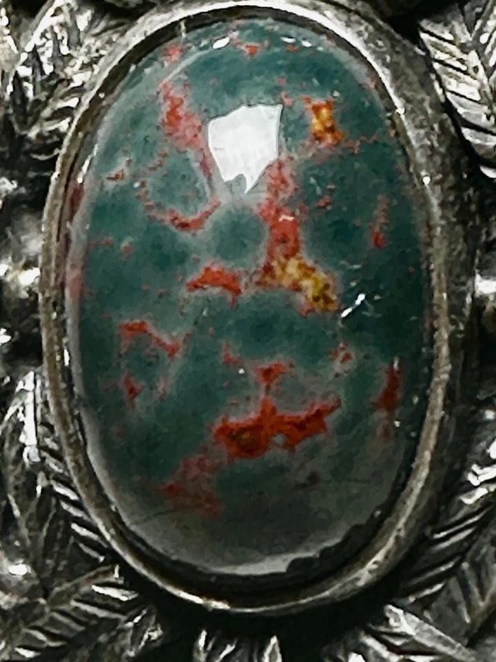 BLOODSTONE RING SIZE 9.50 STERLING SILVER BIKER WOMEN GIRLS: BLOODSTONE RING SIZE 9.50 STERLING SILVER BIKER WOMEN GIRLS Bloodstone ring size 9.50 sterling silver biker women girls Size 9.50 Weight. 14.2g Length. 1" Width. 3/4" Thinnest pat of band 5/32"
