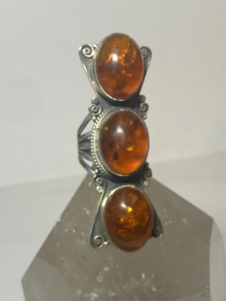 LONG AMBER RING SOUTHWEST STERLING SILVER BAND WOMEN: LONG AMBER RING SOUTHWEST STERLING SILVER BAND WOMEN long amber ring southwest sterling silver band women Size 7.25 Weight 31.7g Length 2. 1/2" Width 7/8" Thinnest part of band 3/16"