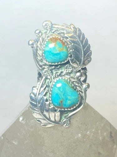 TURQUOISE RING NAVAJO LONG SOUTHWEST STERLING SILVER WOMEN: TURQUOISE RING NAVAJO LONG SOUTHWEST STERLING SILVER WOMEN Turquoise ring Navajo long leaves feathers southwest sterling silver women Size 5.25 Weight 12.5g Length 1. 3/4" Width 1" Thinnest part 1/8"