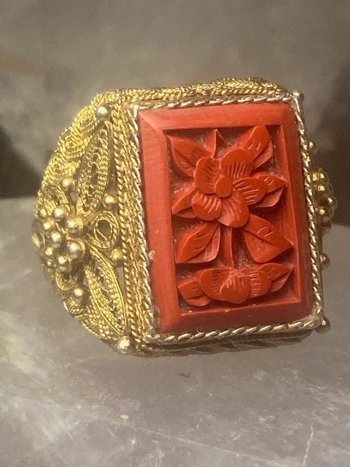 CINNABAR FLORAL RING SIZE 5.50 STERLING SILVER WOMEN: CINNABAR FLORAL RING SIZE 5.50 STERLING SILVER WOMEN Cinnabar floral ring sterling silver filigree women unknown type of gold over sterling Size 5.50 adjustable Weight. 6.8g Length. 3/4" Width. 1/2"" 