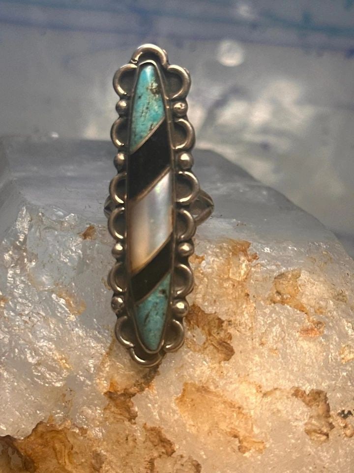 NAVAJO LONG RING TURQUOISE ONYX MOP SIZE 5.75 SCALLOPED STERLING SILVER WOMEN: NAVAJO LONG RING TURQUOISE ONYX MOP SIZE 5.75 SCALLOPED STERLING SILVER WOMEN Navajo long ring turquoise onyx mop size 5.75 sterling silver women Size 5.75 Weight 8.6g Length 2" Width 5/8" Thinnest pa
