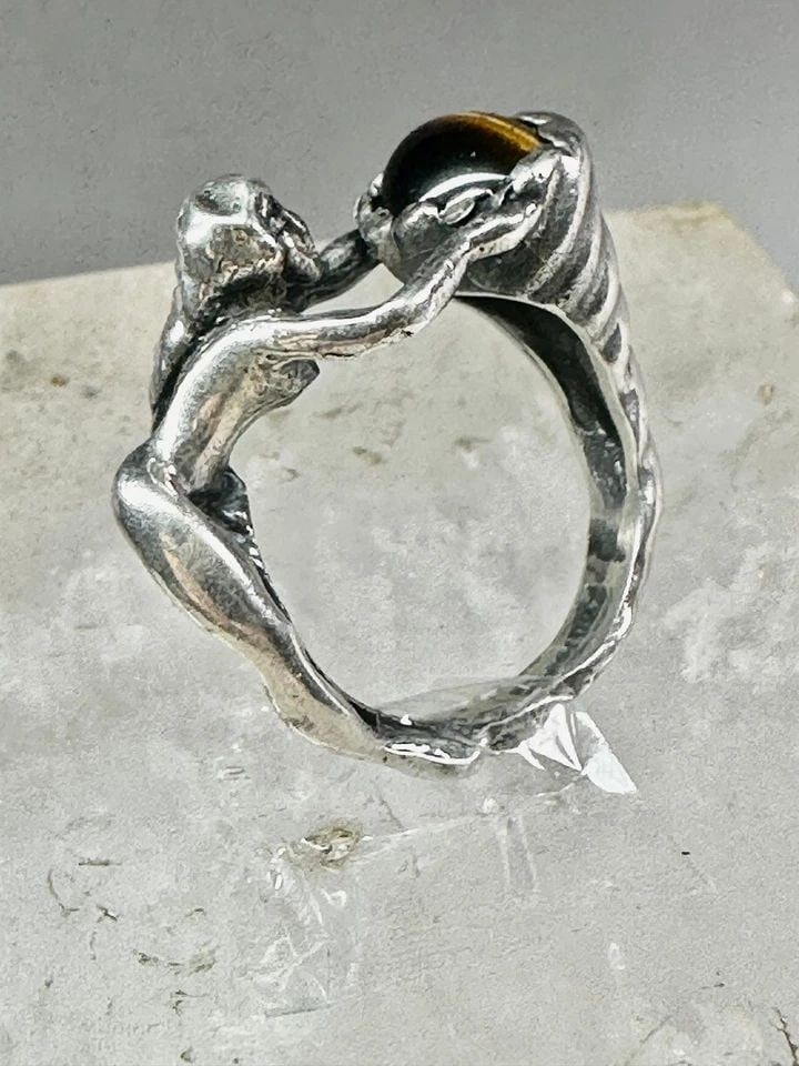 FIGURATIVE RING TIGER EYE CORNUCOPIA NAKED LADY BAND SIZE 7.50 STERLING SILVER W: FIGURATIVE RING TIGER EYE CORNUCOPIA NAKED LADY BAND SIZE 7.50 STERLING SILVER W Figurative ring tiger eye naked lady cornucopia band size 7.50 sterling silver women Size 7.50 Weight 9.3g Widest part 