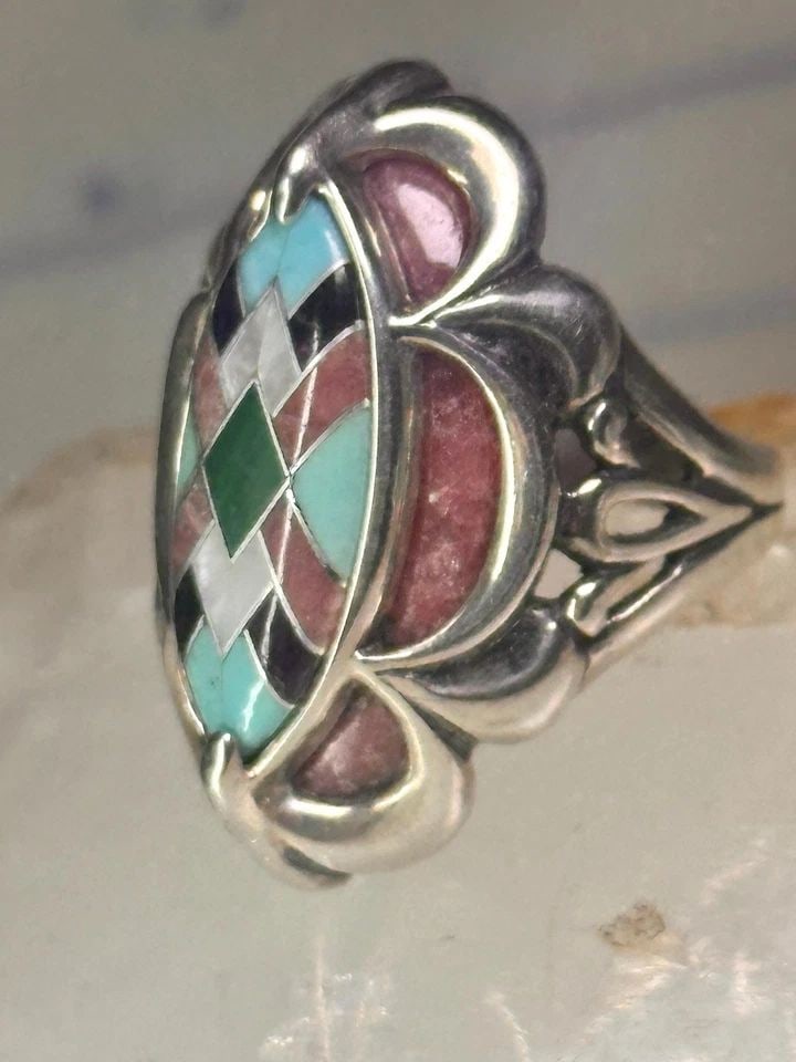 POLLACK RING PINK RHODONITE TURQUOISE SIZE 6 STERLING SILVER WOMEN: POLLACK RING PINK RHODONITE TURQUOISE SIZE 6 STERLING SILVER WOMEN Pollack Ring Pink Rhodonite Turquoise size 6 sterling silver women Size 6 Weight 12.9g Length 1 1/8" Width 1/2" Thinnest part of band
