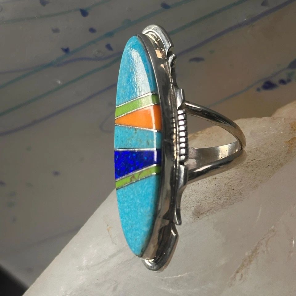 LONG ZUNI RING TURQUOISE SIZE 7.75 INLAID STERLING SILVER WOMEN: LONG ZUNI RING TURQUOISE SIZE 7.75 INLAID STERLING SILVER WOMEN Long Zuni ring Turquoise size 7.75 Inlaid sterling silver women Signed SF Size 7.75 Between a size 7.75 and a size 8 Weight 11.7g length