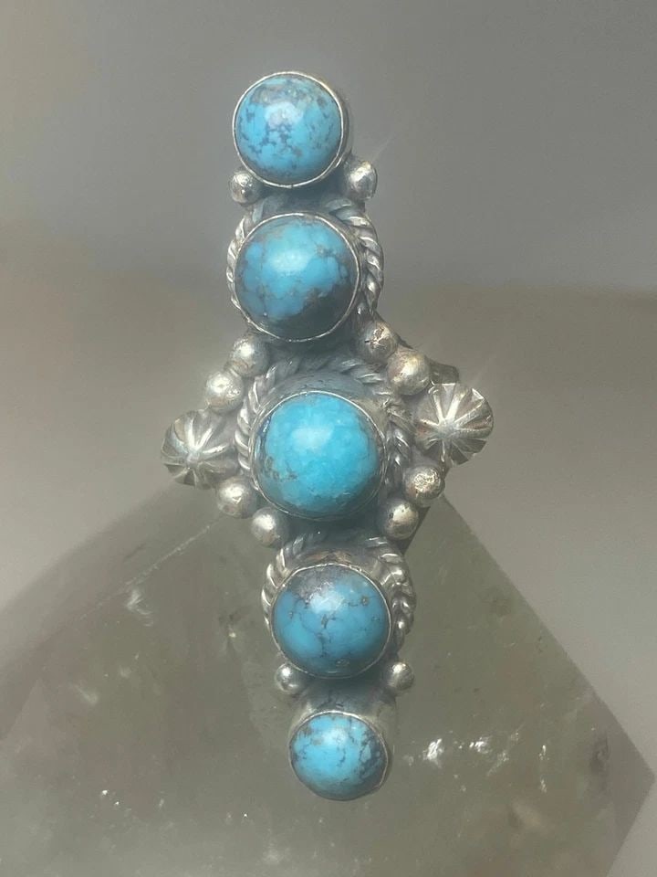 LONG TURQUOISE RING SOUTHWEST STERLING SILVER WOMEN GIRLS: LONG TURQUOISE RING SOUTHWEST STERLING SILVER WOMEN GIRLS Long Turquoise ring southwest sterling silver women girls Size 6.75 Weight 12g Length. 2" Widest part 7/8" Thinnest part 1/8"