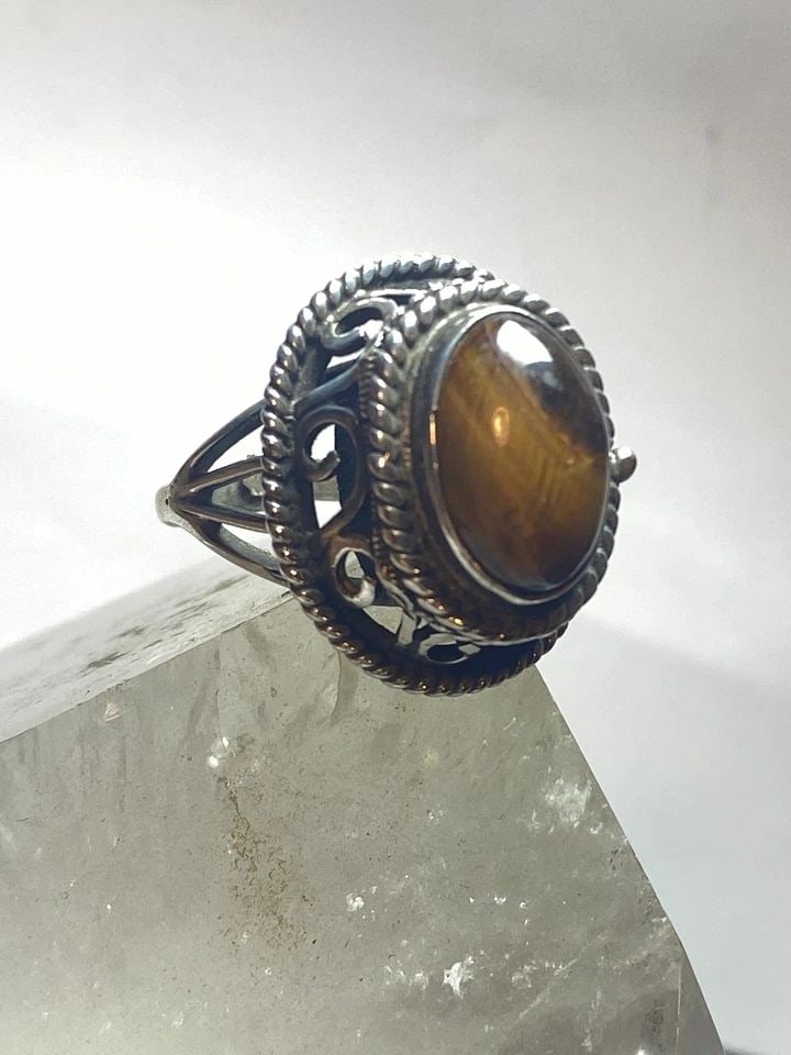 POISON RING SIZE 6 TIGER EYE MEXICO STERLING SILVER WOMEN GIRLS: POISON RING SIZE 6 TIGER EYE MEXICO STERLING SILVER WOMEN GIRLS Poison ring Tiger Eye Mexico sterling silver women girls Size 6 adjustable Weight 10.7g Length. 1" Width 3/4" Thinnest part 1/8"