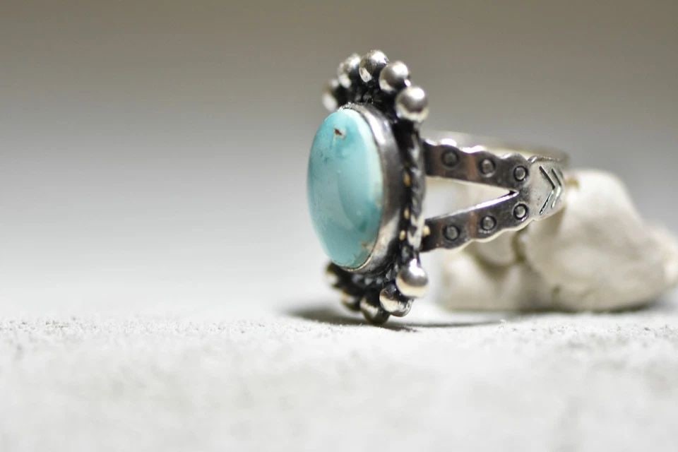 TURQUOISE RING NAVAJO WOMEN GIRLS STAMPED BAND STERLING SILVER: TURQUOISE RING NAVAJO WOMEN GIRLS STAMPED BAND STERLING SILVER Turquoise ring Navajo women girls stamped band sterling silver Size 6 Weight. 5.6g Length 1" Width 5/8" Thinnest part of band. 1/8" Free 