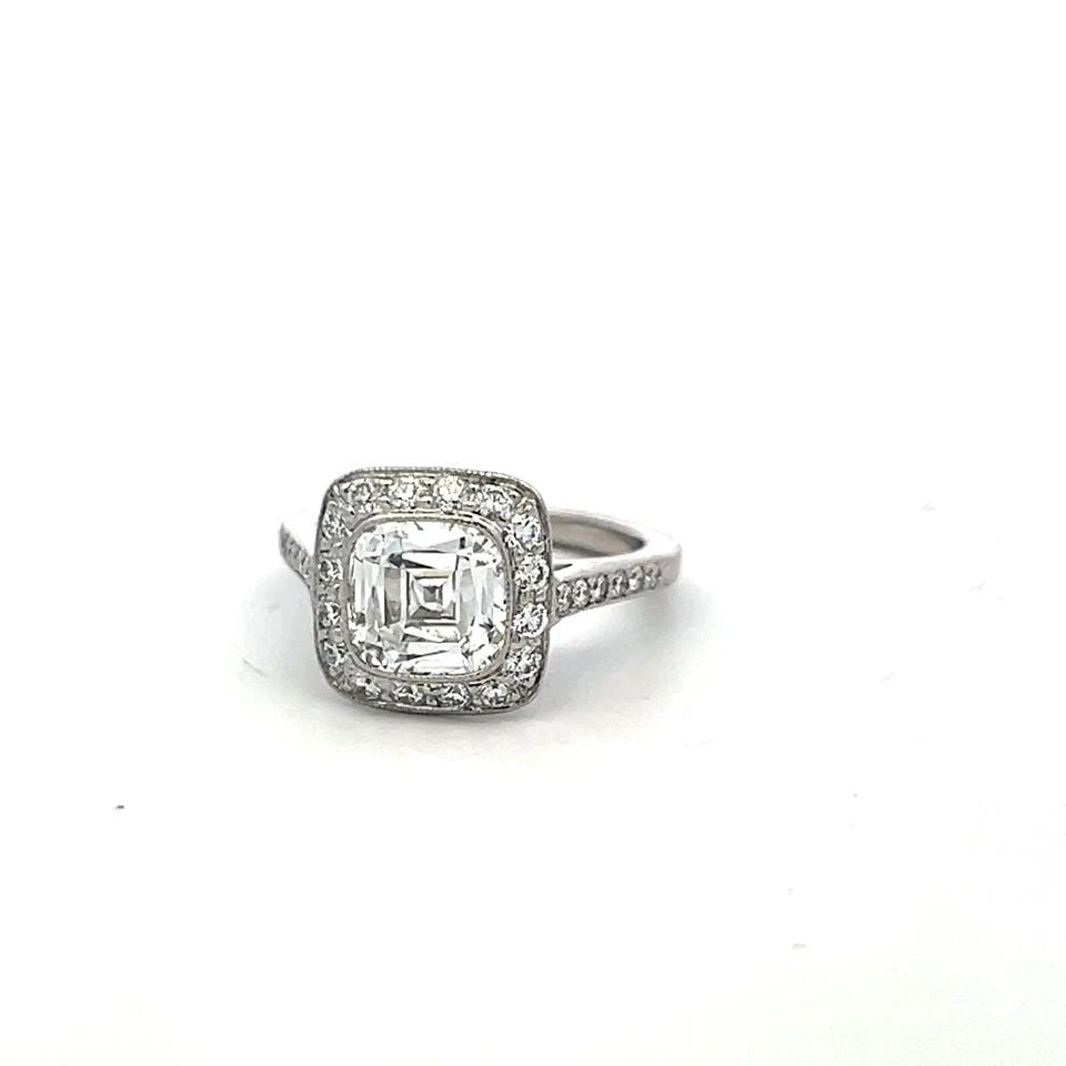 TIFFANY & CO PLATINUM HALO RING WITH 2.65 CARAT CUSHION & ROUND DIAMONDS SIZE 4: TIFFANY & CO PLATINUM HALO RING WITH 2.65 CARAT CUSHION & ROUND DIAMONDS SIZE 4 TIFFANY & CO PLATINUM HALO RING WITH 2.65 CARAT CUSHION & ROUND DIAMONDS SIZE 4 PRODUCT DESCRIPTION Designer: Tiffany & 