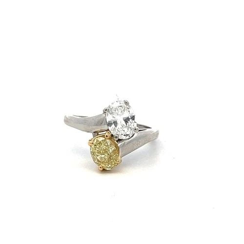 BVLGARI TWO-STONE RING IN 18K GOLD/PLATINUM WITH 2.01 CARAT DIAMOND SIZE 7: BVLGARI TWO-STONE RING IN 18K GOLD/PLATINUM WITH 2.01 CARAT DIAMOND SIZE 7 Designer: BVLGARI Detailed Description: Elevate your style with this stunning Bvlgari two-stone ring crafted in luxurious 18 