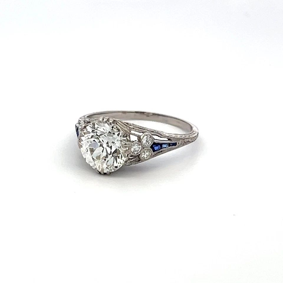 PLATINUM ART DECO RING WITH 2.1CT CIRCULAR BRILLIANT DIAMOND 0.08CT SAPPHIRE GIA: PLATINUM ART DECO RING WITH 2.1CT CIRCULAR BRILLIANT DIAMOND 0.08CT SAPPHIRE GIA PLATINUM ART DECO RING WITH 2.1CT CIRCULAR BRILLIANT DIAMOND 0.08CT SAPPHIRE GIA PRODUCT DESCRIPTION Detailed Descripti