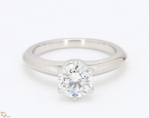 TIFFANY & CO.. 1.06 CARAT H-VVS2 DIAMOND PLATINUM ENGAGEMENT RING: TIFFANY & CO.. 1.06 CARAT H-VVS2 DIAMOND PLATINUM ENGAGEMENT RING Title: Tiffany and Co 1.06 Carat Round Brilliant Shape H-VVS2 Diamond Platinum Engagement Ring Style: Engagement Metal: Platinum Gemst