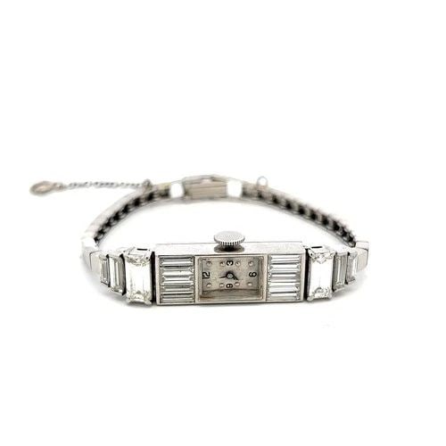 VINTAGE PLATINUM WRISTWATCH WITH 5 CARAT BAGUETTE SHAPE DIAMONDS: VINTAGE PLATINUM WRISTWATCH WITH 5 CARAT BAGUETTE SHAPE DIAMONDS VINTAGE PLATINUM WRISTWATCH WITH 5 CARAT BAGUETTE SHAPE DIAMONDS PRODUCT DESCRIPTION Detailed Description: In a world where elegance wh