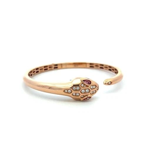 18K ROSE GOLD BANGLE BRACELET WITH 0.25 CARAT DIAMONDS AND 0.32 CARAT TOURMALINE: 18K ROSE GOLD BANGLE BRACELET WITH 0.25 CARAT DIAMONDS AND 0.32 CARAT TOURMALINE Detailed Description: Vintage 18K Rose Gold Bangle with Diamonds & Tourmaline Gems DESCRIPTION: Elevate your style with