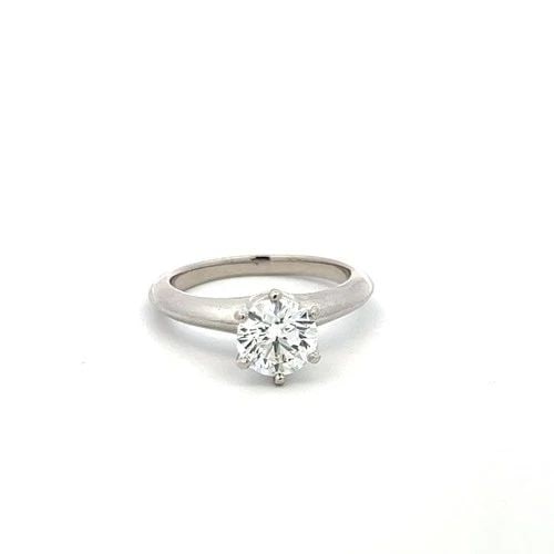 TIFFANY & CO PLATINUM ENGAGEMENT RING WITH 1.09 CARAT ROUND H-VS2 GIA DIAMOND: TIFFANY & CO PLATINUM ENGAGEMENT RING WITH 1.09 CARAT ROUND H-VS2 GIA DIAMOND Designer: Tiffany & Co Detailed Description: Experience timeless elegance with this Tiffany & Co. vintage platinum engagem