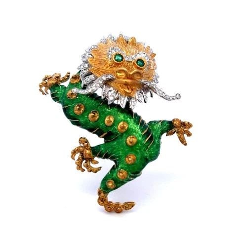 18K TWO-TONE GOLD DRAGON BROOCH WITH DIAMONDS AND EMERALD EYES VINTAGE: 18K TWO-TONE GOLD DRAGON BROOCH WITH DIAMONDS AND EMERALD EYES VINTAGE PRODUCT DESCRIPTION Title: This vintage two-tone 18 karat gold dragon brooch features bold green enamel work accented with approx