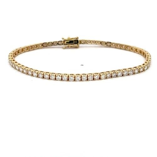 5.58CT ROUND DIAMOND 14K YELLOW GOLD CLASSIC TENNIS BRACELET: 5.58CT ROUND DIAMOND 14K YELLOW GOLD CLASSIC TENNIS BRACELET Title: This elegant vintage tennis bracelet features 5.58 carats of round brilliant-cut diamonds set in warm 14K yellow gold. The 62 diamon