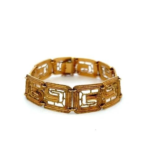 LALOUNIS 18K YELLOW GOLD GREEK KEY LINK VINTAGE BRACELET ESTATE JEWELRY: LALOUNIS 18K YELLOW GOLD GREEK KEY LINK VINTAGE BRACELET ESTATE JEWELRY Designer: lalaoonis Title: This distinctive vintage and estate Lalounis link bracelet is crafted in rich 18 karat yellow gold, s