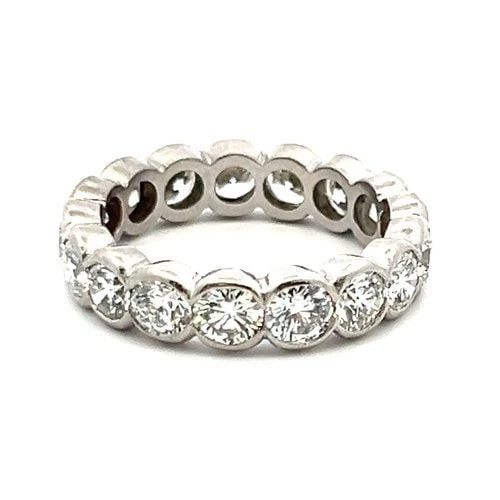3.20 CARAT ROUND BRILLIANT E VS1 DIAMOND PLATINUM FULL ETERNITY BAND RING: 3.20 CARAT ROUND BRILLIANT E VS1 DIAMOND PLATINUM FULL ETERNITY BAND RING Title: This elegant platinum full-eternity band showcases 3.20 carats of exceptional E VS1 round brilliant diamonds, bezel-set