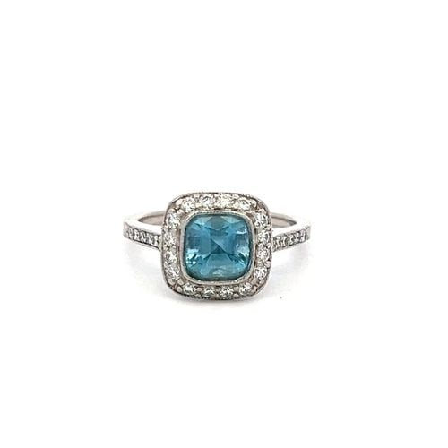 TIFFANY & CO 1.06 CARAT AQUAMARINE 0.50 CARAT ROUND DIAMOND PLATINUM HALO RING: PRODUCT DESCRIPTION Designer: Tiffany & Co Title: Tiffany & Co 1.06 Carat Cushion Modified Brilliant Cut 0.50 Carat Round Brilliant F VS Diamond Platinum Halo Ring Style: Halo Metal: Platinum Gemstone
