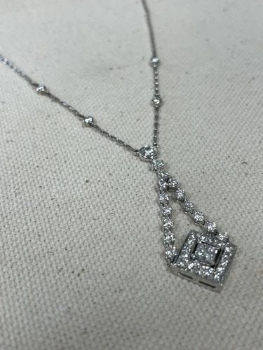 KWIAT 18K WHITE GOLD DIAMOND SWING NECKLACE: KWIAT 18K WHITE GOLD DIAMOND SWING NECKLACE Elevate any outfit with this stunning KWIAT Swing necklace Crafted from 18K white gold, it features a square pendant with 36 natural diamonds in a prong set