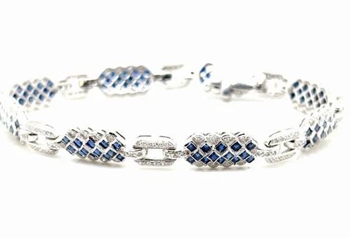 VINTAGE BLUE SAPPHIRE AND DIAMOND TENNIS BRACELET IN .950 PLATINUM: VINTAGE BLUE SAPPHIRE AND DIAMOND TENNIS BRACELET IN .950 PLATINUM This stunning bracelet features approximately 2 carats of Natural blue sapphires and 25cts of Diamonds set in 950 Platinum! The vibra