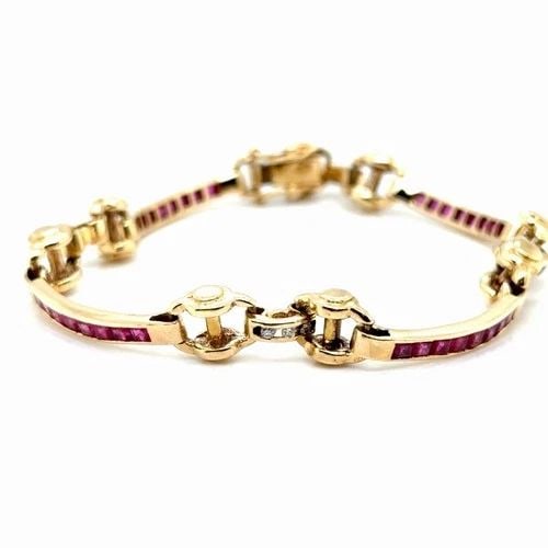 RUBY & DIAMOND BRACELET IN 14K YELLOW GOLD WITH APPROXIMATELY 1.50CTS OF RUBY: RUBY & DIAMOND BRACELET IN 14K YELLOW GOLD WITH APPROXIMATELY 1.50CTS OF RUBY This stunning bracelet features approximately 1 50 carats of natural red rubies and 12 round brilliant diamonds set in 18k