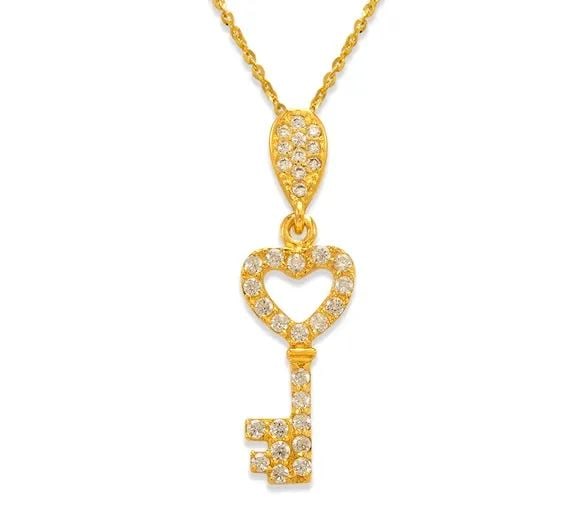NEW 14K YELLOW GOLD FANCY HEART KEY PENDANT: NEW 14K YELLOW GOLD FANCY HEART KEY PENDANT FANCY HEART KEY PENDANT NEW 14K YELLOW GOLD Apx. WIDTH: 8x19mm Apx WEIGHT: 1.2g