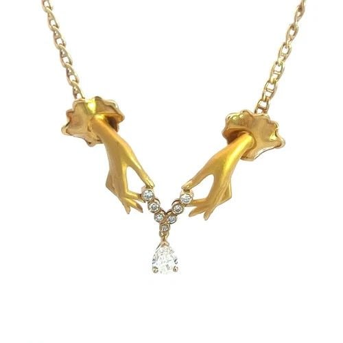 CARRERA Y CARRERA DIAMOND GOLD NECKLACE 18K YELLOW HAPPY HANDS PENDANT: CARRERA Y CARRERA DIAMOND GOLD NECKLACE 18K YELLOW HAPPY HANDS PENDANT This stunning Carrera y Carrera necklace is a piece of fine jewelry featuring a unique double woman hand holding a diamond neckla